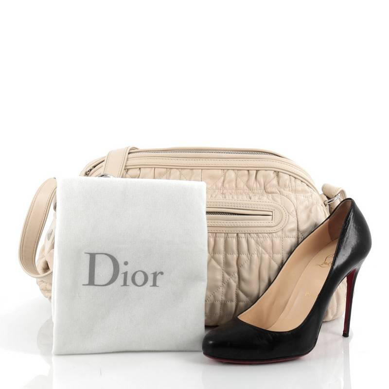 This authentic Christian Dior Delidior Dome Shoulder Bag Cannage Quilt Leather is a beautiful and classically styled bag perfect for your day or evening looks. Crafted from cream cannage quilt leather, this chic bag features adjustable leather