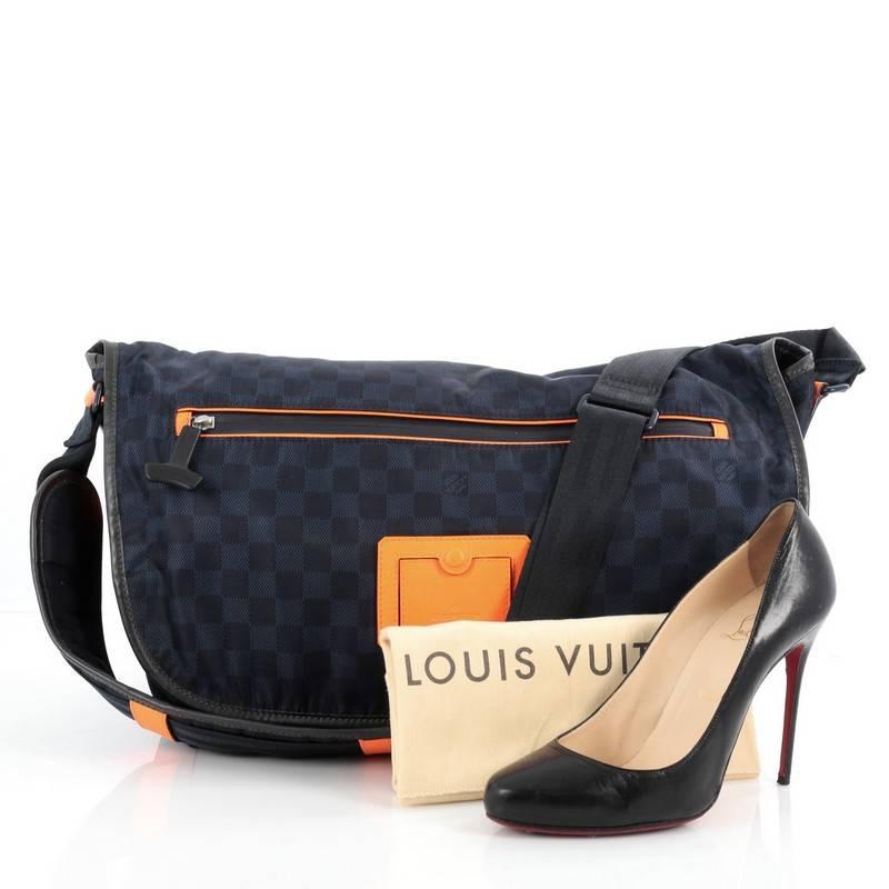 This authentic Louis Vuitton Challenge Messenger Damier Nylon is from the brands' Spring-Summer 2013 Collection that combines classic Louis Vuitton design cues with the latest in high tech materials. Crafted from blue damier nylon, this messenger