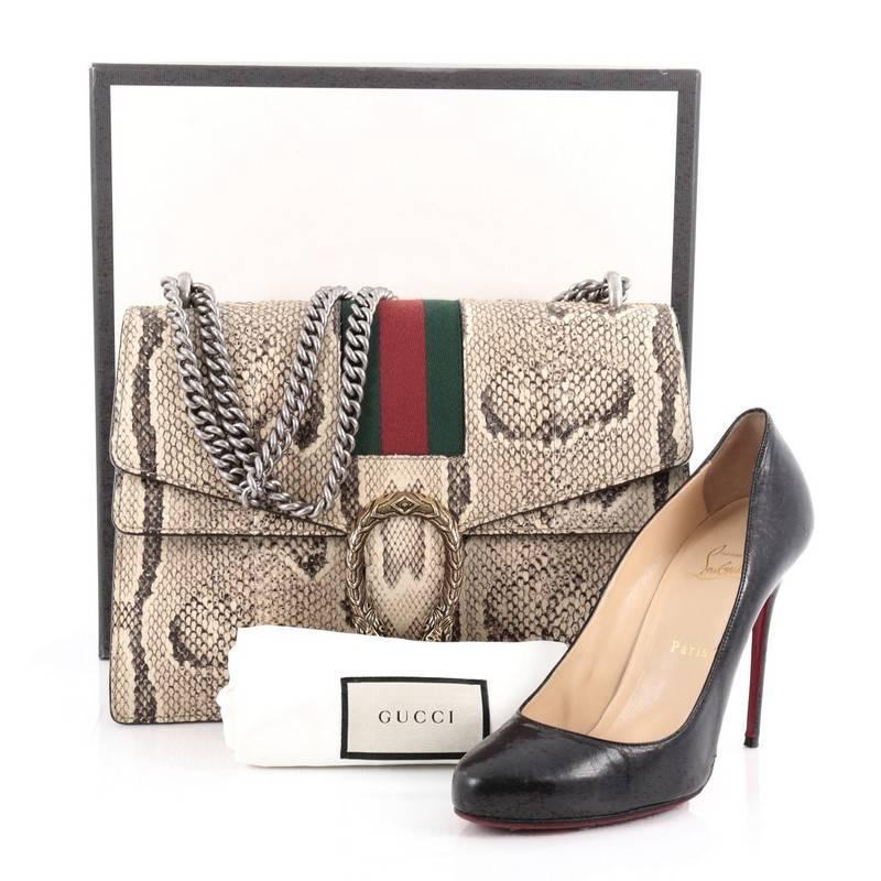 This authentic Gucci Web Dionysus Handbag Python Medium named after the Greek god of wine is an easy to carry everyday handbag that is both stylish and functional. Crafted from genuine beige python skin, this satchel features a chain link strap,