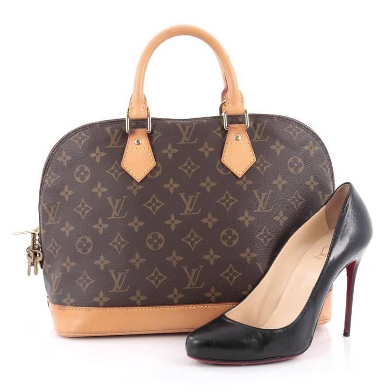 This authentic Louis Vuitton Vintage Alma Handbag Monogram Canvas PM gives a unique twist to the classic Alma perfect for your everyday use. Crafted in iconic brown monogram coated canvas, this dome-shaped satchel showcases dual-rolled handles,