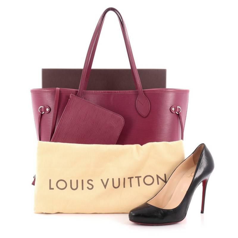 This authentic Louis Vuitton Neverfull Tote Epi Leather MM is a perfect companion for daily excursions. Crafted in berry purple epi leather, this iconic, easy-to-carry tote features dual flat leather handles, side tassels that cinches and expands