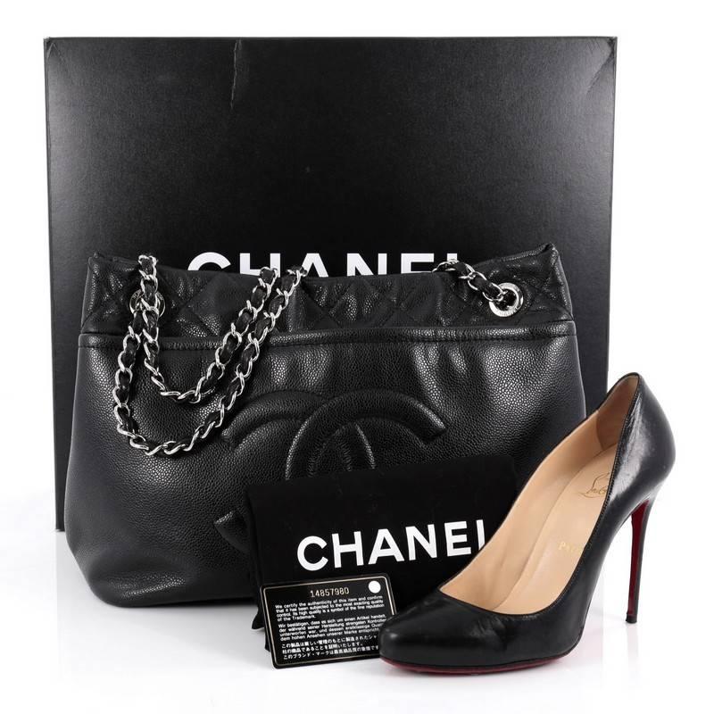 This authentic Chanel Timeless CC Soft Tote Caviar Large showcases the brand's classic style perfect for the modern woman. Crafted from sturdy black caviar leather, this stylish tote features Chanel's signature oversized stitched timeless CC design,