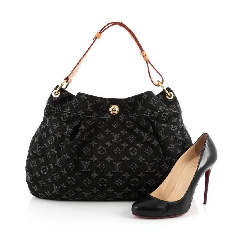 This authentic Louis Vuitton Daily Handbag Denim PM is a contemporary take on a classic style for a modern day on-the-go fashionista. Crafted from black monogram denim, this feminine hobo features an adjustable vachetta leather shoulder strap,