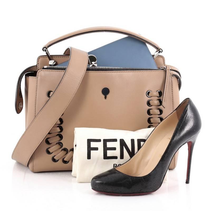 This authentic Fendi DotCom Convertible Satchel Whipstitch Leather Medium is a chic and minimalist bag perfect for your everyday looks. Crafted from beige leather, this understated satchel features a flat top handle, removable shoulder strap,