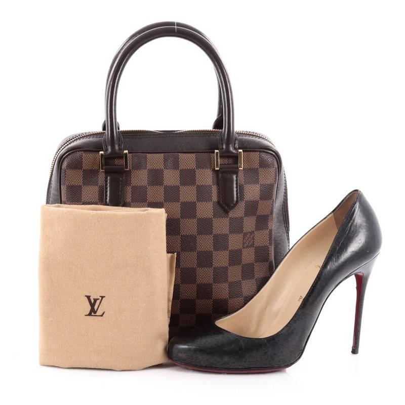 This authentic Louis Vuitton Brera Handbag Damier is a versatile everyday bag that's perfect to add to your collection. Crafted from damier ebene coated canvas, this bag features dual-rolled leather handles, brown leather trims, and gold-tone