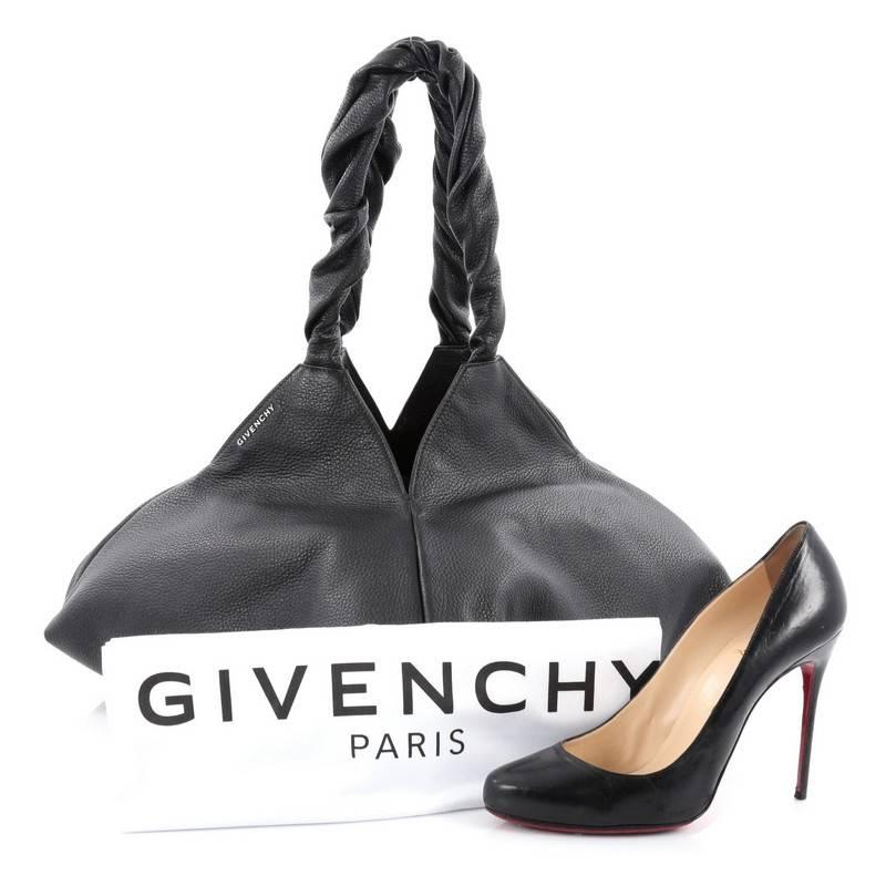 This authentic Givenchy Pyramid Shoulder Bag Leather displays an urban style and dark romanticism with tough-luxe detailing and a rock'n'roll elegance. Crafted from black leather, this edgy bag features dual twisted shoulder straps, geometric