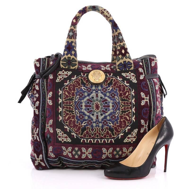 This authentic Gucci Hysteria Tote Tapestry Large is truly a lovely accessory for any Gucci lover, showcasing a kitschy yet intricately-made design. Crafted from purple multicolored decorative tapestry fabric, this eye-catching tote showcases dual