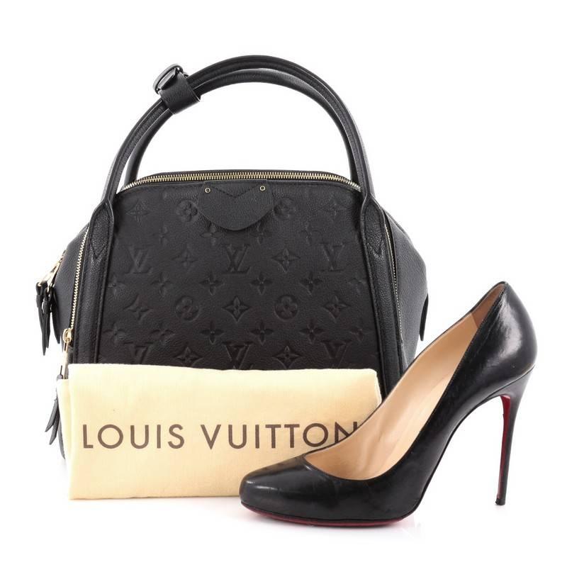 This authentic Louis Vuitton Marais Handbag Monogram Empreinte Leather MM is a re-styling of the classic bowling bag that show casual and chic style made perfect for everyday life. Crafted from black monogram empreinte leather, this bowler features