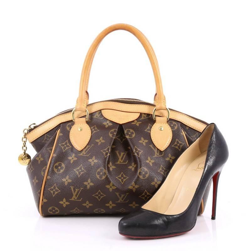 This authentic Louis Vuitton Tivoli Handbag Monogram Canvas PM inspired by the Italian city itself combines chic and feminine luxury for everyday use. Crafted from iconic brown monogram coated canvas, this bag features dual-rolled vachetta leather