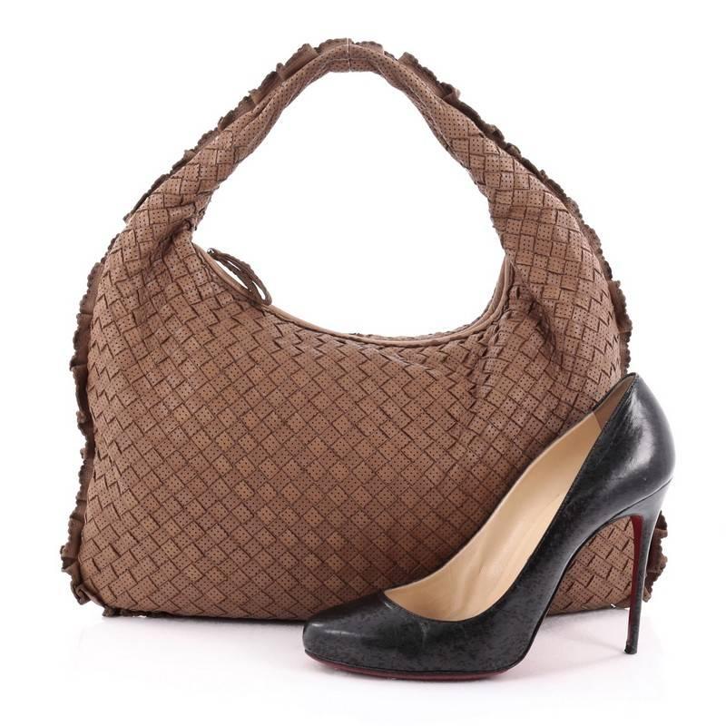 This authentic Bottega Veneta Veneta Hobo Perforated Intrecciato Nappa Medium is a timeless piece to add to your collection. Crafted from brown perforated intrecciato nappa leather, this bag features Bottega's signature woven looping leather