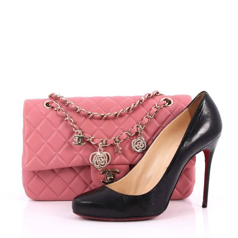 This authentic Chanel Valentine Crystal Hearts Flap Bag Quilted Lambskin Medium mixes Chanel's classic design with playful kitschy detailing. Constructed in luxurious pink lambskin leather with Chanel's signature diamond quilting, this bag features