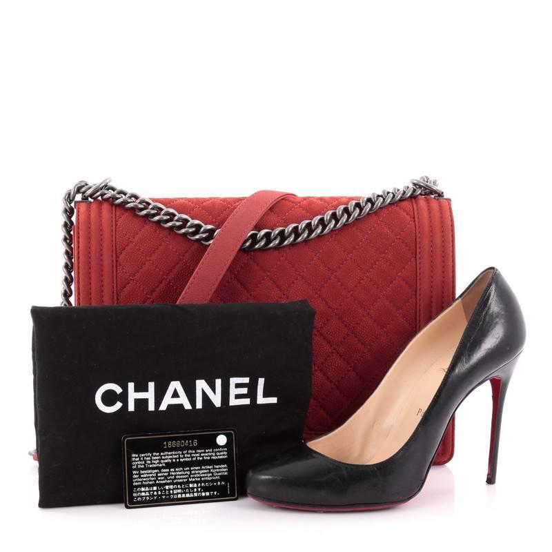This authentic Chanel Boy Flap Bag Quilted Matte Caviar Large is every woman's dream. Crafted from terracotta red diamond quilted matte caviar leather, this popular, enviable Boy flap bag features a aged silver chunky chain link strap with leather