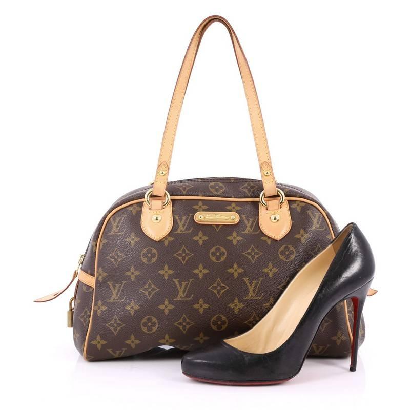This authentic Louis Vuitton Montorgueil Handbag Monogram Canvas PM is a perfect casual travel companion. Crafted in iconic brown monogram canvas, this functional bag features tall dual-flat vachetta leather handles and trims, gold plated