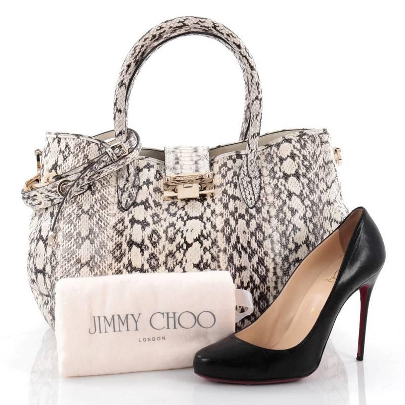This authentic Jimmy Choo Rania Convertible Satchel Elaphe Large is an easy, spacious, hand-held tote bag that's perfect for your everyday looks. Crafted from black and off- white genuine elaphe snakeskin, this exotic chic bag features dual rolled