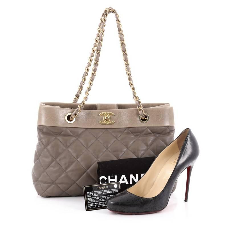 This authentic Chanel Soft Elegance Tote Quilted Distressed Calfskin Medium presented in the brand's Fall/Winter 2013 Collection mixes classic Chanel styling with a modern twist. Crafted from distressed quilted calfskin in taupe, this beautiful tote