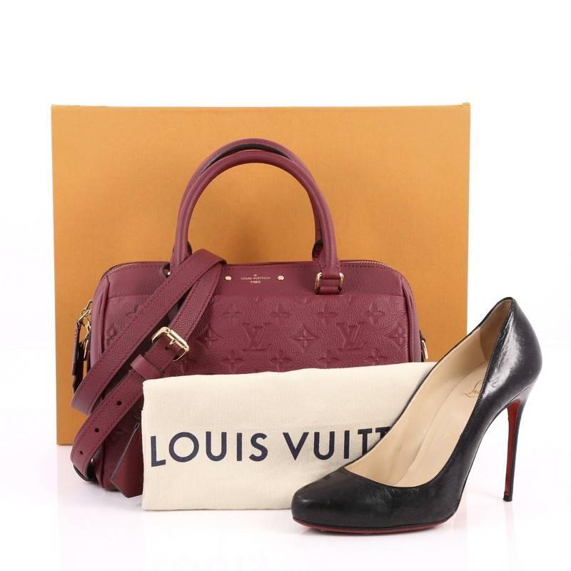 This authentic Louis Vuitton Speedy Bandouliere NM Handbag Monogram Empreinte Leather 25 is a modern must-have. Constructed from Louis Vuitton's luxurious plum monogram embossed empreinte leather, this iconic and re-imagined Speedy features