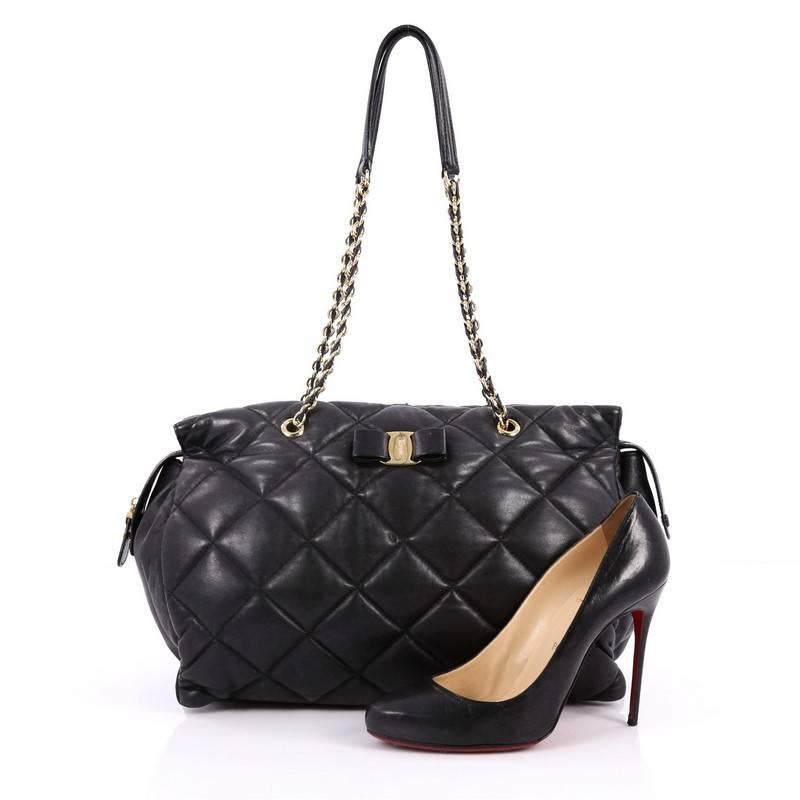 This authentic Salvatore Ferragamo Ginette Chain Shoulder Bag Quilted Leather Large has a feminine-classic design perfect for the modern day fashionista. Crafted from black quilted leather, this chic bag features dual woven-in leather chain strap