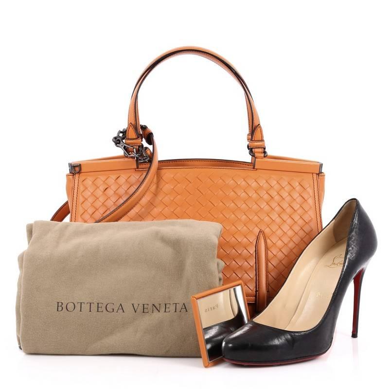 This authentic Bottega Veneta Monaco Convertible Satchel Leather with Intrecciato Detail Medium is a bag with a polished silhouette and plenty of room to carry all day. Crafted from orange leather with intrecciato detailing, this boxy satchel