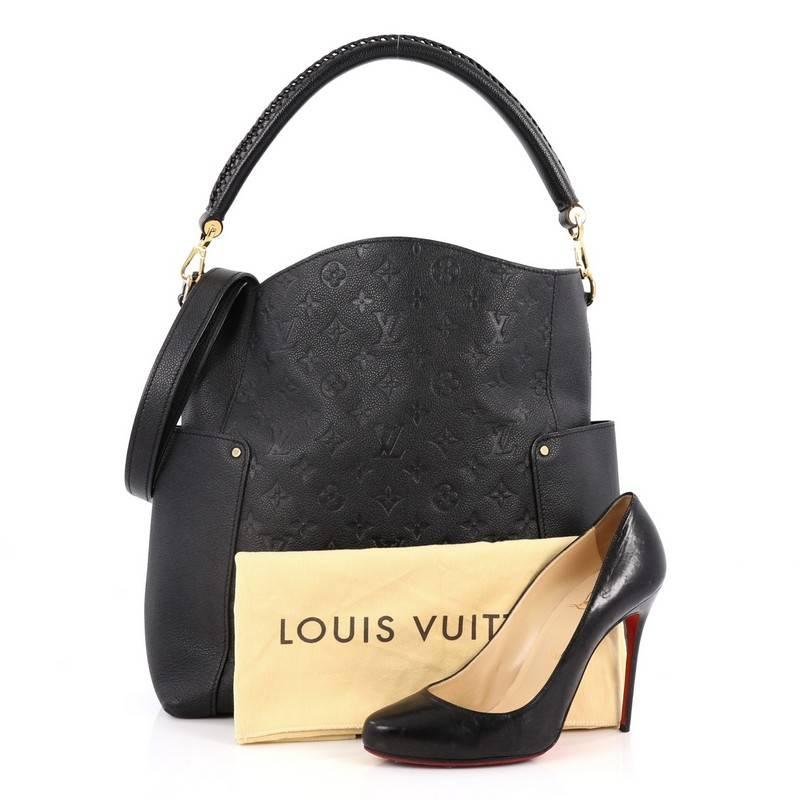 This authentic Louis Vuitton Bagatelle Hobo Monogram Empreinte Leather is a versatile and chic bag perfect for your everyday looks. Crafted from black monogram empreinte leather with leather trims, this luxurious hobo features a braided handle,