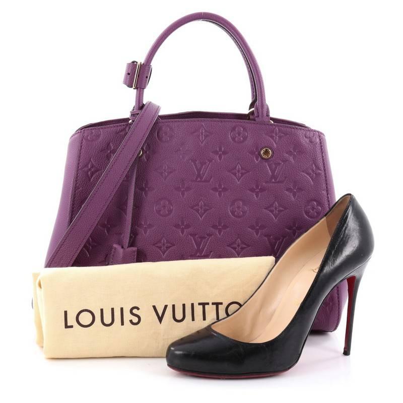 This authentic Louis Vuitton Montaigne Handbag Monogram Empreinte Leather MM named after the famed Parisian location is as sophisticated as it is sturdy. Crafted in purple monogram empreinte leather, this luxurious and refined bag features