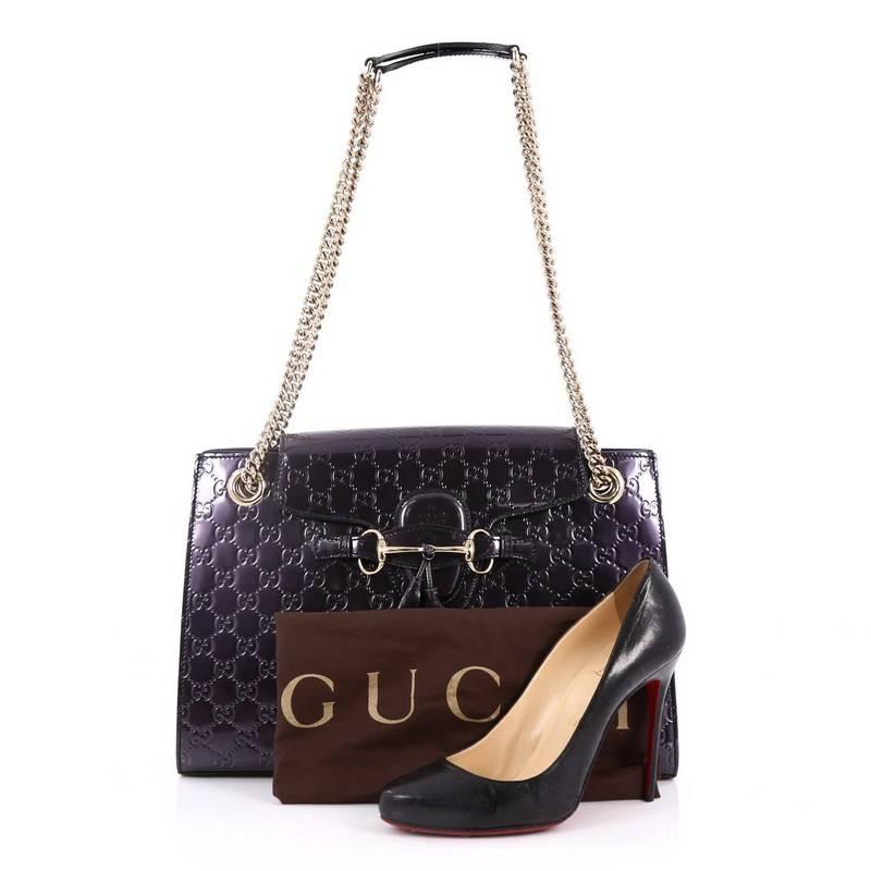 This authentic Gucci Emily Chain Flap Shoulder Bag Guccissima Patent Large is a stylish accessory perfect for a day to evening look. Crafted in purple patent leather in embossed guccissima pattern, this flap bag features Gucci's iconic horsebit
