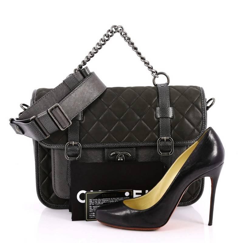 This authentic Chanel Paris-Bombay Back to School Messenger Quilted Iridescent Calfskin Large is from the brands Pre-Fall 2012 Metiers d'Art Collection. Crafted from dark grey quilted iridescent calfskin and metallic pewter leather, this chic bag