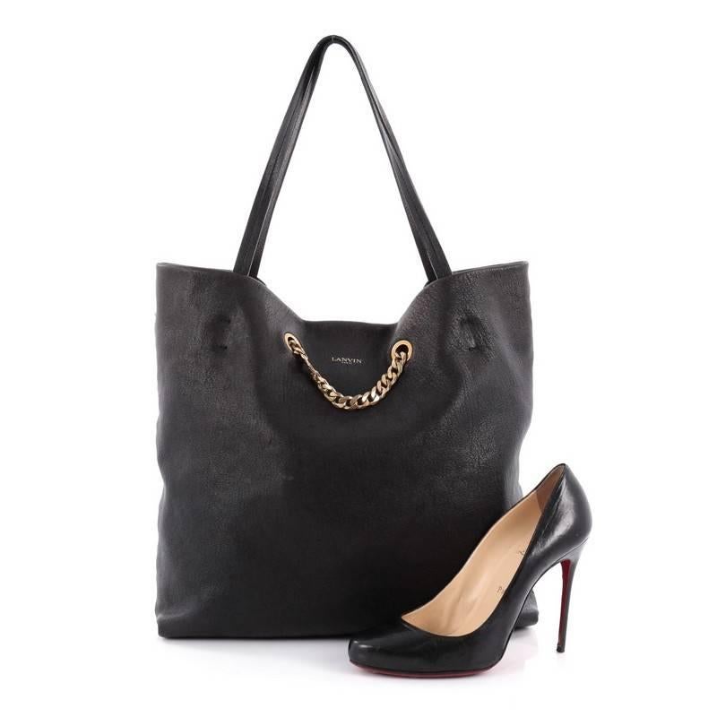 This authentic Lanvin Carry Me Tote Leather Medium first introduced in the brand's 2014 Collection mixes understated, elegant style with casual-cool sophistication. Crafted from black leather, this chic, no-fuss tote features dual flat shoulder