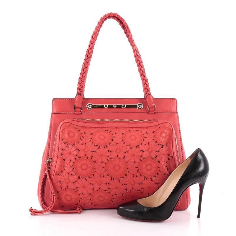 This authentic Valentino Demetra Tote Leather Lace showcases a chic and stylish design made for day-to-day excursions. Crafted in red leather, this romantic, feminine tote features braided leather straps, a large front zip-around pocket with braided