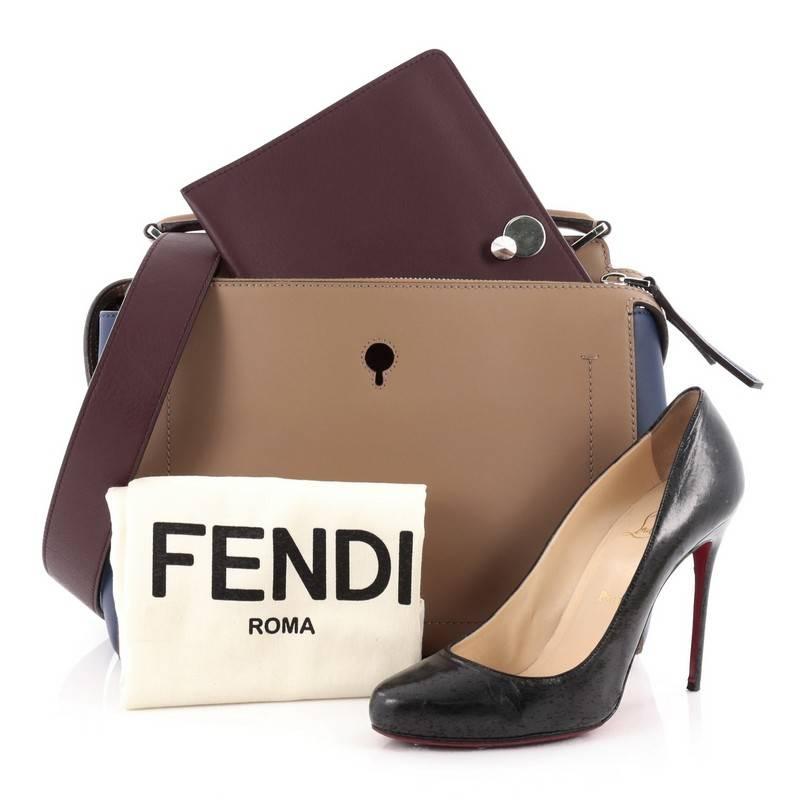 This authentic Fendi DotCom Convertible Satchel Leather Medium presented in the brand's 2015-2016 Collection is a chic and minimalist bag perfect for your everyday looks. Crafted from beige and navy blue leather, this understated satchel features a