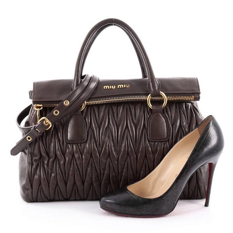 This authentic Miu Miu Fold Over Zip Convertible Satchel Matelasse Leather Large is iconic and romantically chic in design that glams up any casual look. Crafted in brown matelasse leather, this bag features dual-rolled leather handles, a detachable