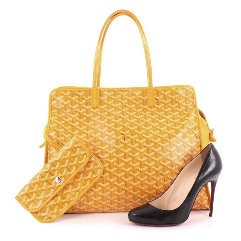 This authentic Goyard Hardy Pet Carrier Coated Canvas PM is the perfect stylish travel companion for your little one. Constructed in classic yellow Goyard chevron canvas print with yellow leather trimmings, this spacious dog carrier is equipped with