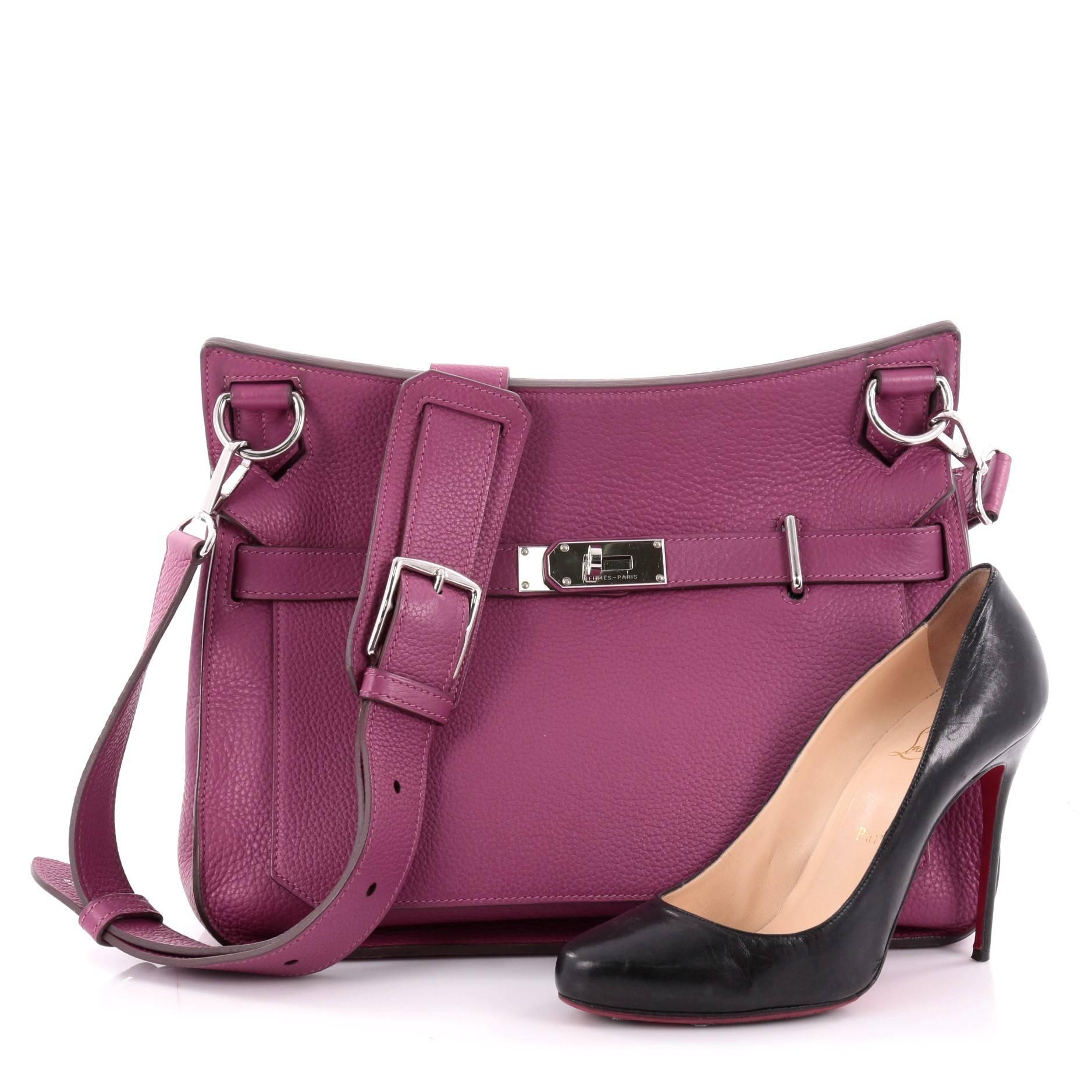 This authentic Hermes Jypsiere Handbag Clemence 34 is a current and favorite style among Hermes lovers. Inspired by the brand's iconic Kelly bag, this luxurious and industrial messenger is crafted in scratch-resistant tosca purple leather featuring