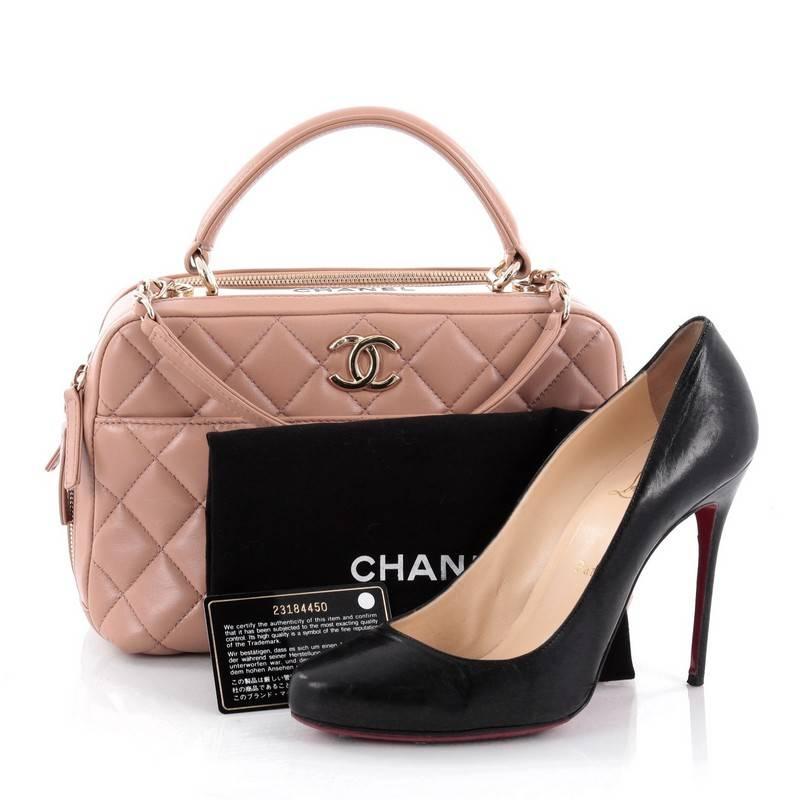 This authentic Chanel Trendy CC Bowler Bag Quilted Leather Medium is a marvelous day or evening bag from the brands' Pre-Spring 2014 Collection Act 1. Crafted from pink mauve quilted leather, this chic bag features leather top handle, woven-in