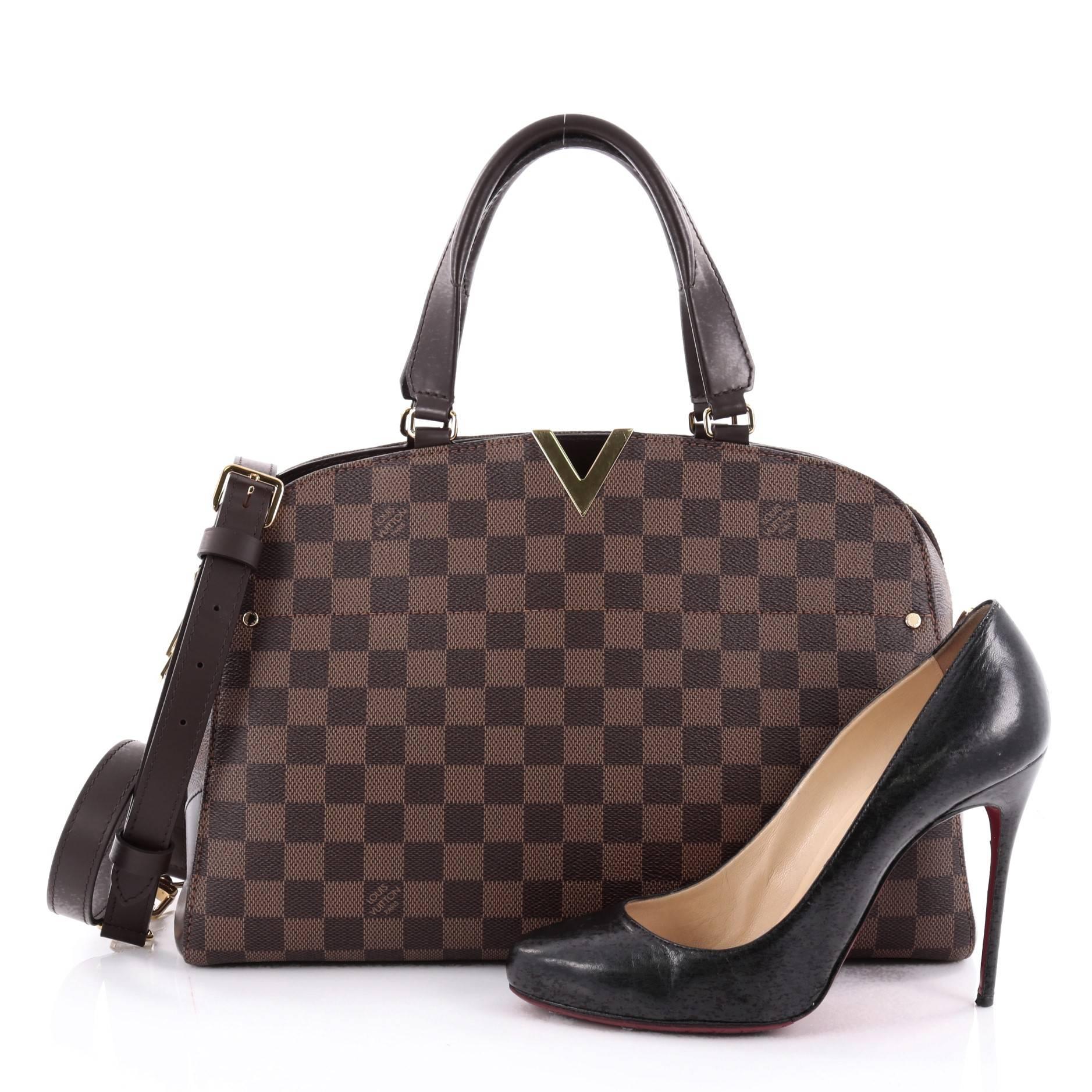 This authentic Louis Vuitton Kensington Bowling Bag Damier presented in the brand's Spring/Summer 2015 Collection is a chic and durable everyday bag made for the modern woman. Crafted from iconic Louis Vuitton’s damier ebene canvas, this bowling bag