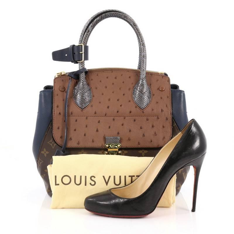This authentic Louis Vuitton Majestueux Tote Monogram Canvas and Exotics PM presented in the brand's Fall/Winter 2012 Collection showcases an avant-garde design inspired by the brand's luxurious heritage. Crafted from the brand’s signature brown