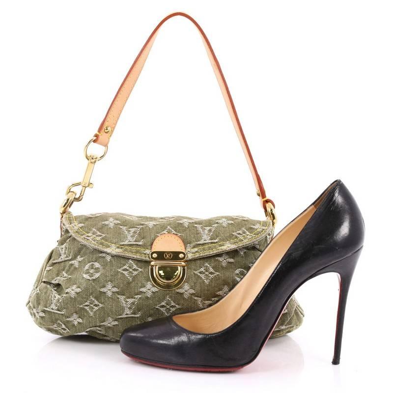 This authentic Louis Vuitton Pleaty Handbag Denim Mini is a fun and flirty bag from the brand's Monogram Denim collection. Crafted from green monogram denim, this mini shoulder bag features vachetta leather handle allowing it to transform into a
