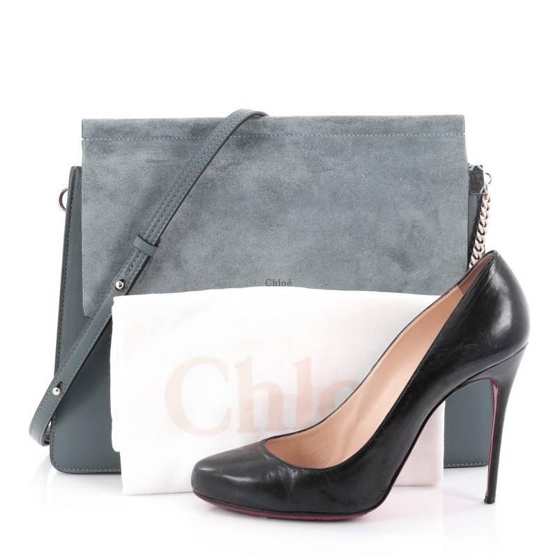This authentic Chloe Faye Shoulder Bag Leather and Suede Medium presented in the brand's 2015 Collection personifies Chloe's unique luxe bohemian aesthetic with an ode to the 70's. Crafted in teal suede and leather, this sleek bag features a ring