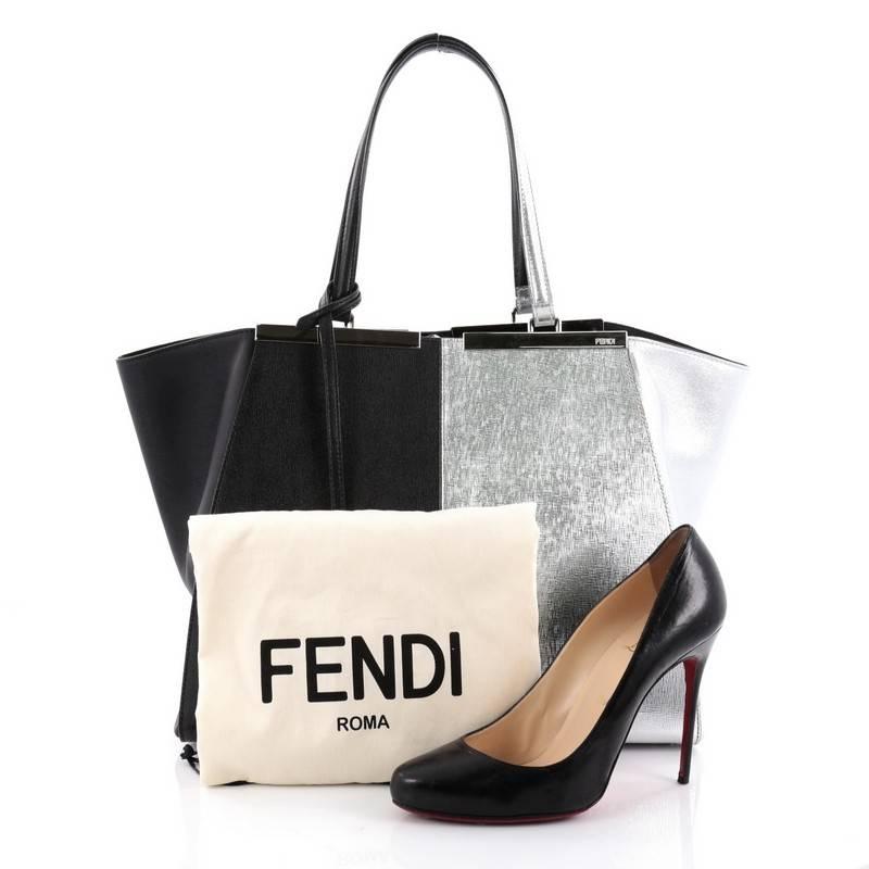 This authentic Fendi Bicolor 3Jours Handbag Leather Large updated from its popular predecessor the 2Jour tote is impeccably stylish. Crafted in bicolor black and silver metallic leather, this minimalist tote features a shining split top bar that