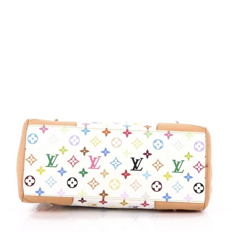 This authentic Louis Vuitton Claudia Handbag Monogram Multicolor makes a perfect city bag for on-the-go fashionistas. Crafted from white multicolor monogram coated canvas, this sleek bowler style bag features dual flat leather handles, vachetta