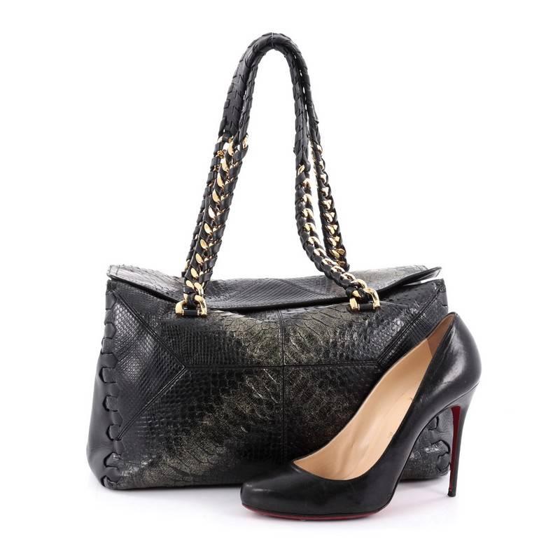 This authentic Roberto Cavalli Regina Shoulder Bag Python Medium is a chic and stylish bag perfect to add to your collection. Crafted from genuine black and gold python skin, this bag features dual braided leather on chain-link shoulder strap, woven
