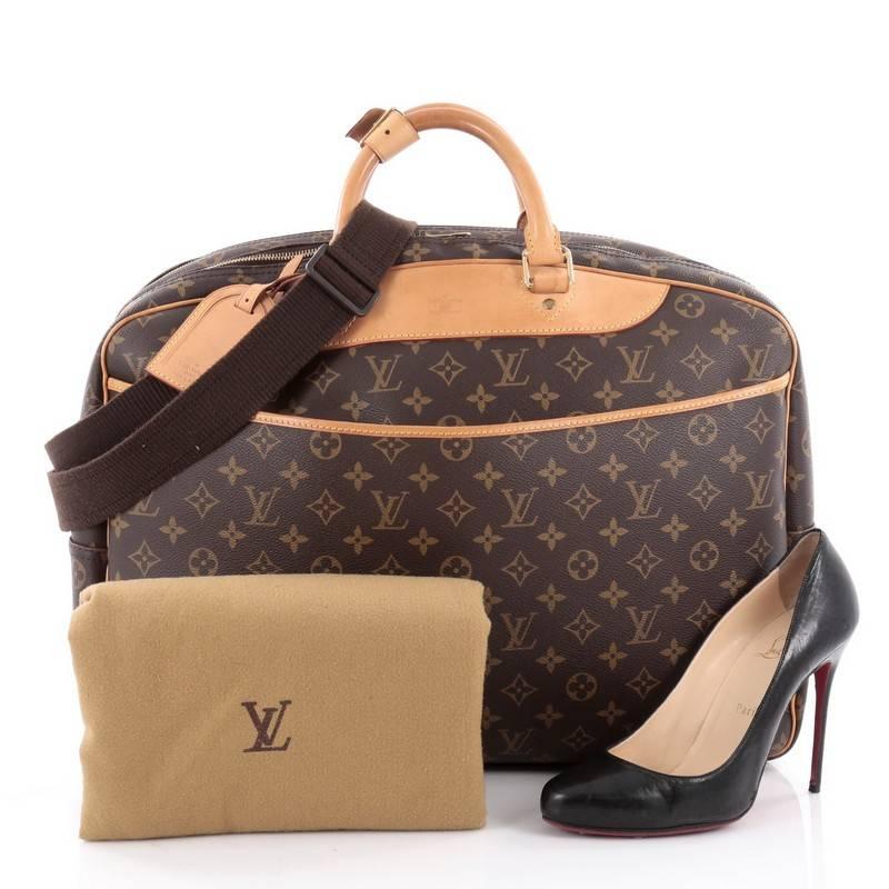 This authentic Louis Vuitton Alize Monogram Canvas 24 Heures is stylish alternative to the square soft suitcase, perfect for a carry-on or weekend travel. Crafted from brown monogram coated canvas with leather trims, this oversized travel bag