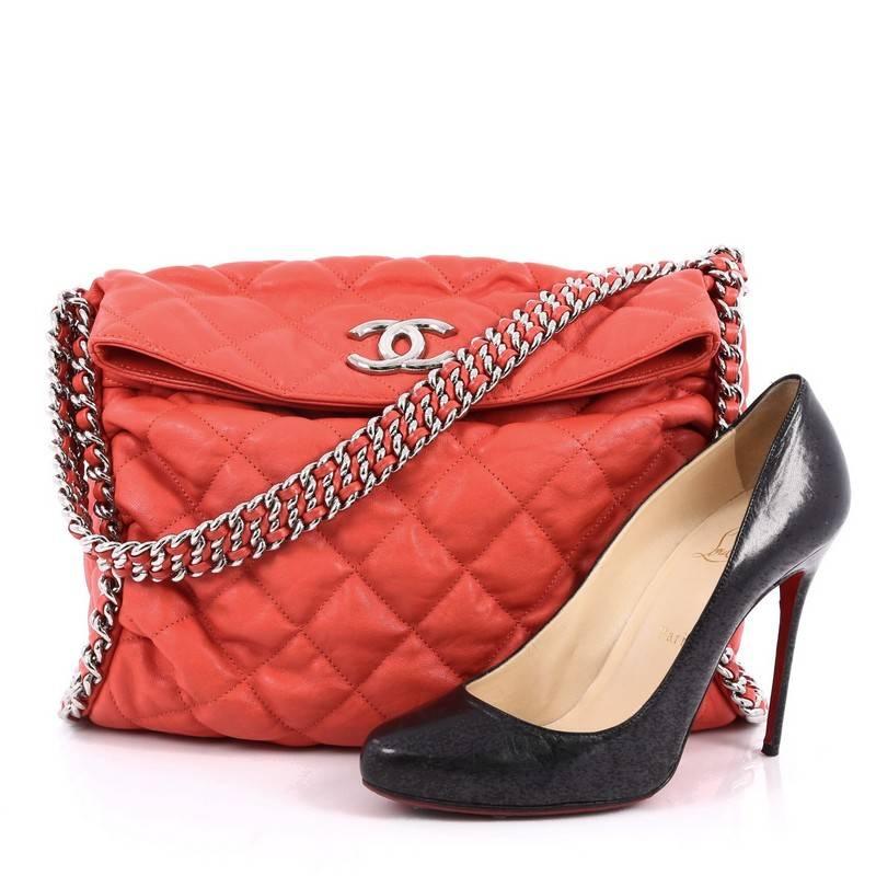 This authentic Chanel Chain Around Hobo Quilted Washed Lambskin is synonymous to casual luxury. Crafted with red washed lambskin in Chanel's signature diamond quilting, this stylish no-fuss hobo features multiple silver woven-in leather chain straps