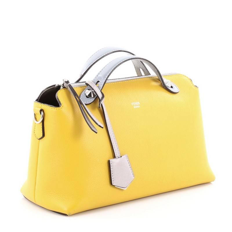 This authentic Fendi By The Way Satchel Calfskin Small, presented in the brand's 2014 Collection, showcases a modern, understated style admired by every fashionista. Constructed from yellow calfskin leather, this minimalist and functional duffle
