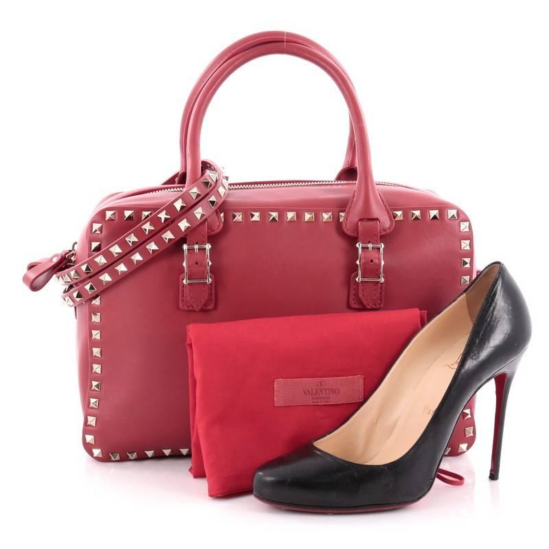This authentic Valentino Rockstud Convertible Zip Satchel Leather Medium is the perfect daily bag for the on-the-go fashionista. Crafted from beautiful red leather, this stylish bag features dual-rolled top handles, detachable strap, gold-tone