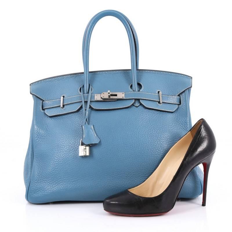 This authentic Hermes Birkin Handbag Blue Jean Clemence with Palladium Hardware 35 stands as one of the most-coveted bags. Crafted from scratch-resistant, iconic blue jean clemence leather, this stand-out tote features dual-rolled top handles,