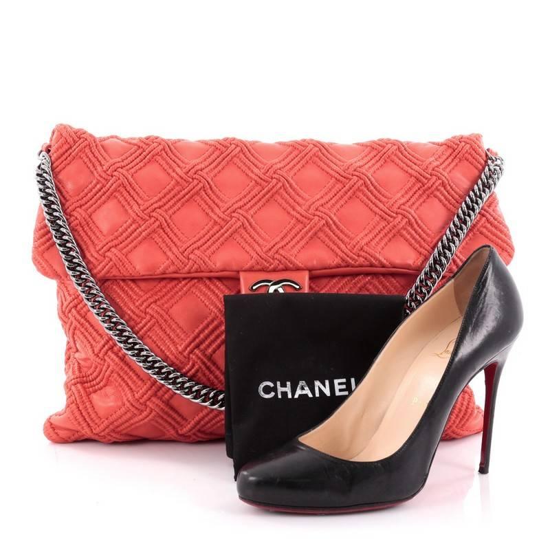 This authentic Chanel Walk of Fame Bag Quilted Leather Large, from the brands' 2008 Cruise Collection, is perfect for your day or night looks. Crafted from beautifully quilted coral red leather, this stylish bag features bijoux chain strap, metal CC