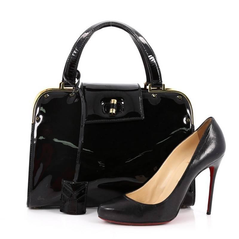 This authentic Saint Laurent Uptown Handbag Patent Small is ideal for the style conscious professional. This boxy, sleek tote is constructed with black patent leather, this bag features dual flat leather handles, polished gold top frame for a
