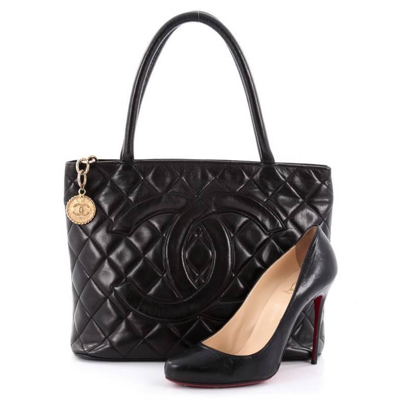 This authentic Chanel Medallion Tote Quilted Lambskin is an iconic tote in a versatile sleek style that will complement a multitude of looks. Crafted from black quilted lambskin leather, this tote features dual-rolled tall handles, an oversized