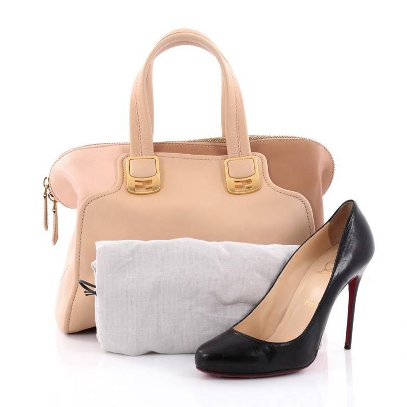 This authentic Fendi Chameleon Satchel Leather Small showcases a simple, classic design with a modern twist. Constructed in light pink and beige multicolor leather, this stylish satchel features dual top handles accented with gold Fendi FF logo