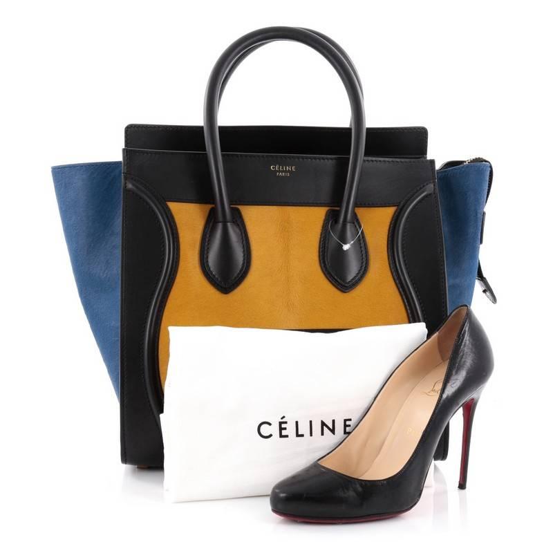 This authentic Celine Tricolor Luggage Handbag Pony Hair and Leather Mini is one of the most sought-after bags beloved by fashionistas. Crafted from genuine tricolor yellow and blue pony hair with black leather, this minimalist tote features